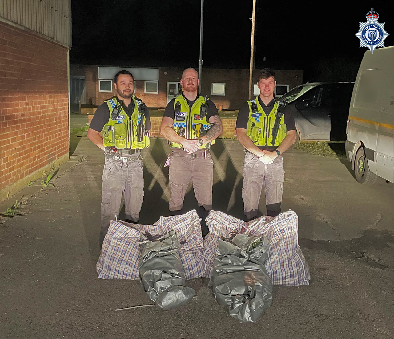 Officers with some of the seized plants