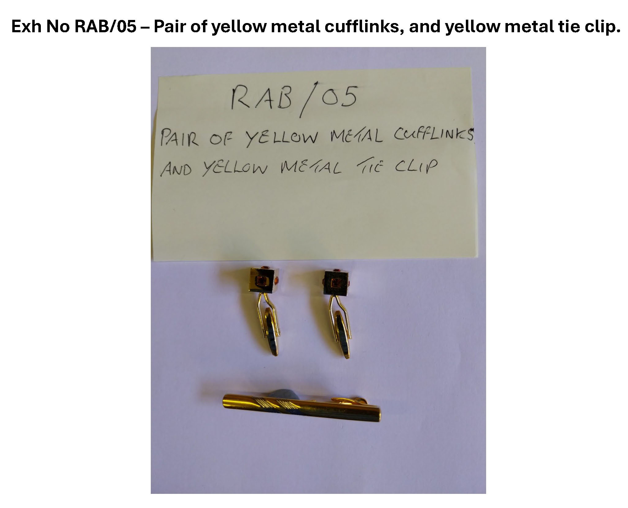 Pair of yellow metal cufflinks and yellow metal tie clip.jpg
