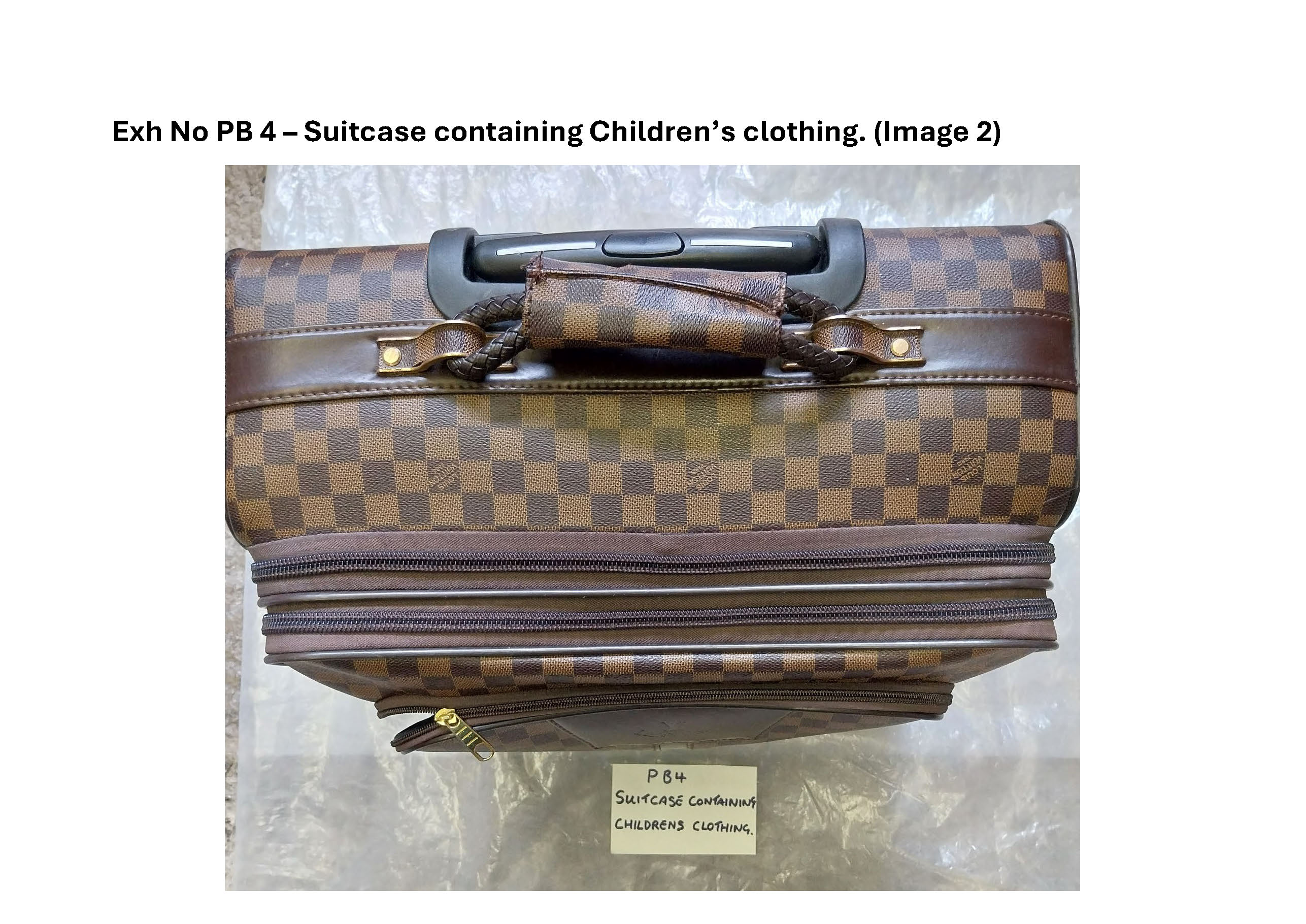 PB4 suitcase containing childrens clothing 2.jpg